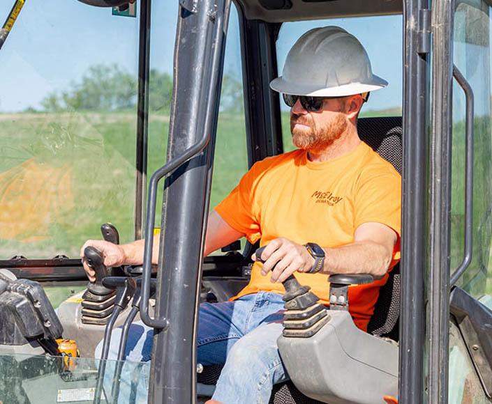McElroy Excavation employee operating equipment.